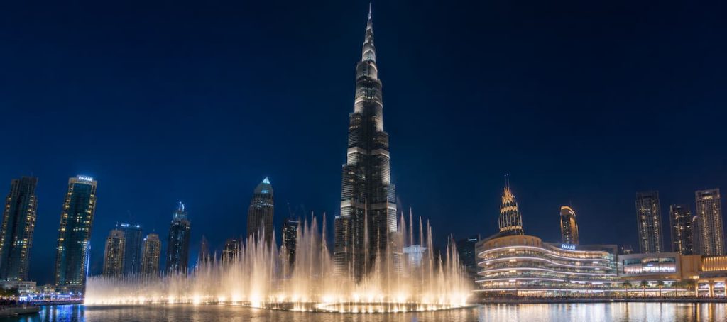 Downtown Dubai Guide: Burj Khalifa, Mall & Where to Stay 1 Burj Khalifa illuminated at night with the Dubai Fountain performing below