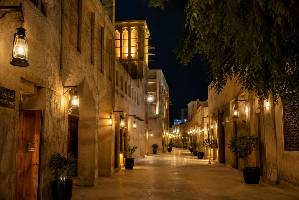 Old Dubai Souks: Gold, Spice, Textile — and the Customs Rules Every Indian Buyer Must Know 1 Traditional lantern-lit architecture in an Old Dubai heritage lane at night